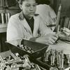 African American woman testing nuts and bolts