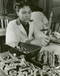 African American woman testing nuts and bolts