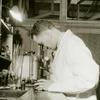 African American man looking into a microscope at the medical unit of the Astoria Work Experience Center