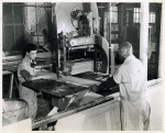 Negro and white youth at work in the woodmill