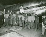 A group photograph of African American veterans with their veteran friends getting into a bus after flight, Washington, D.C.