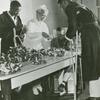 African American veterans, disabled ex-service men patients in U.S. Veterans Hospital, Tuskegee, Alabama, making Buddy Poppies (red artificial flowers) for the Veterans of Foreign Wars Sale which will be conducted nationally during the week preceding Memorial Day