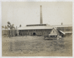 Back view of factory building.