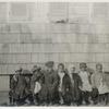 Group portrait of Howard Orphanage and Industrial School children sitting on bench.]
