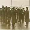 Pres. Hoover being saluted aboard a ship.