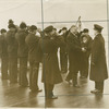 Pres. Hoover being saluted aboard a ship.