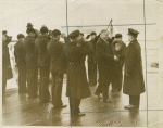 Pres. Hoover being saluted aboard a ship.