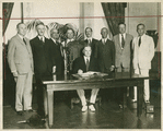 President Hoover in the hour of victory: signing the Naval Limitation Pact.