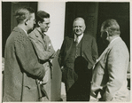 Ex-Pres. Hoover talking with three men.