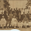 Herbert Hoover on seated with others on the deck of a warship.