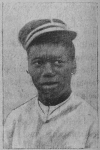 Haitian man wearing a kepi.