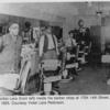 José Toribio Lara (front left) inside his barber shop at 1704 14th Street, in Ybor City. c. 1925
