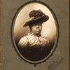 Oval studio portrait of unidentified woman in large feathered hat.