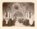 Interior view of a church with a group of nuns