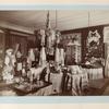 Large room with displays of embroidery towels, tableclothes, pillow cases, costumes, dolls and napkins, etc.