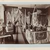 General view of the exhibition, featuring tablecloths and dolls in different costumes, even a lamp with laces lampshades