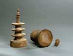 Two of The Million Prayer Towers (Hyakumantô 百万塔) showing the base of The Nine-Ringed Spire Prayer Tower inscribed “2nd month, 29th day” (云二月廿九日) and base of tower finial inscribed Yumi 弓 ('bow')