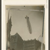 Dirigible passing over Tribune building.