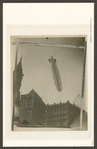 Dirigible passing over Tribune building.