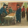 An applevendor in native attire, Volendam.
