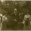 Man and two women, outdoors
