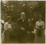 [Man and two women, outdoors.]