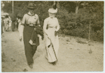 Two women walking.
