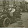 Congress members in a motor car.