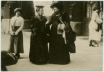 Two women in conversation on the street.