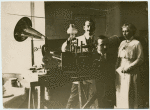 Unidentified woman making a phonograph.
