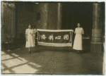 Rose Meller and Laura Meller holding Chinese flag.