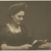 Unidentified woman reading a book