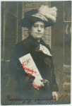Vilma Glucklich [holding a copy of "A No" the Hungarian feminist newspaper].