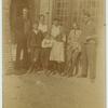 Palthe family group photo, in front of house.