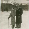 Mr. and Mrs. Roth on the snow, in front of a mountain.