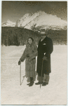 Mr. and Mrs. Roth on the snow, in front of a mountain.