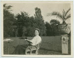 Woman reading a book outside.