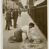 London life. A woman pavement artist. To be seen in ringsway.