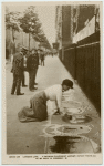 London life. A woman pavement artist. To be seen in ringsway.