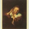 Rembrandt.  Girl trying on earring.