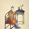 Woman seated on a wooden bench, playing a small drum or gong