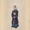 Man with white beard wearing beaded necklace and tunic with design of large white bird
