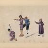 Man is tied to cross-shaped frame; another man kneels.