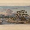 Small house under tree near river with stone bridge.
