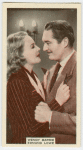 Wendy Barrie and Edmund Lowe in "Newsboys' home."