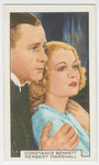 Constance Bennett and Herbert Marshall in "A woman of the world."