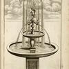 Fountain with two basins, multiple spouts, and central nude female figure.