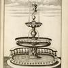 Fountain with two central basins and sculpture of nude youth holding dolphin