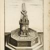 Fountain with octagonal basin and central sculpture of a tower with lions and a bird