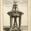 Fountain with basin on two footed supports, with central sculpture of two horses.
